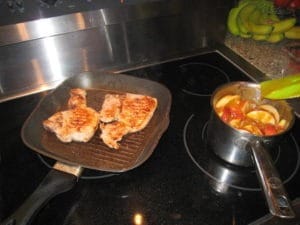 Food Travelist Pork Chops With Apples And Onions On The Stovetop