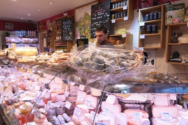 Cheese shop on walking tour Paris food experiences in paris