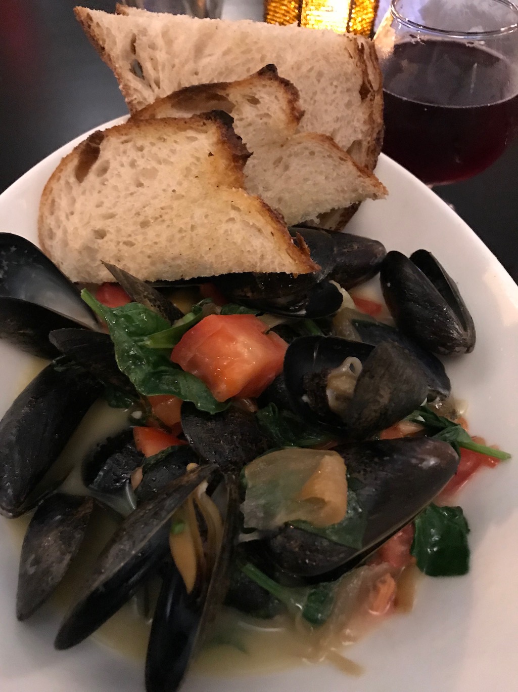 Michigan Beer Mussels with tomatoes caramelized onions roasted garlic and spinach Green Well Grand Rapids