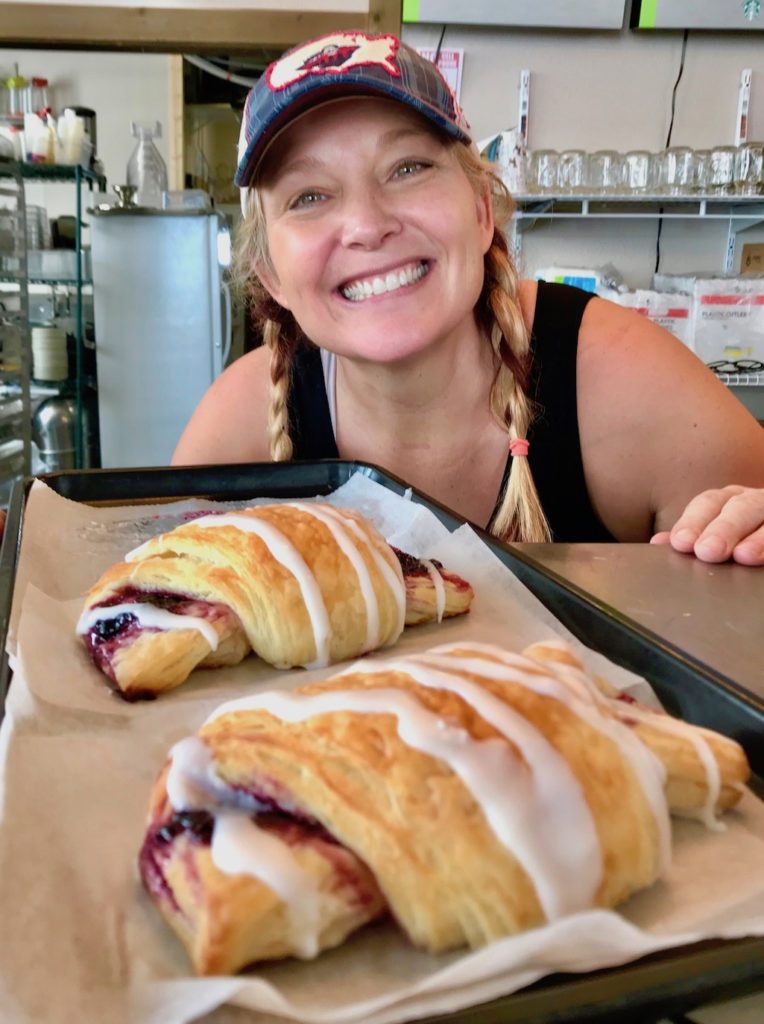 Kim At Mountain Mama Cafe in West Yellowstone with her Huckleberry Turnover