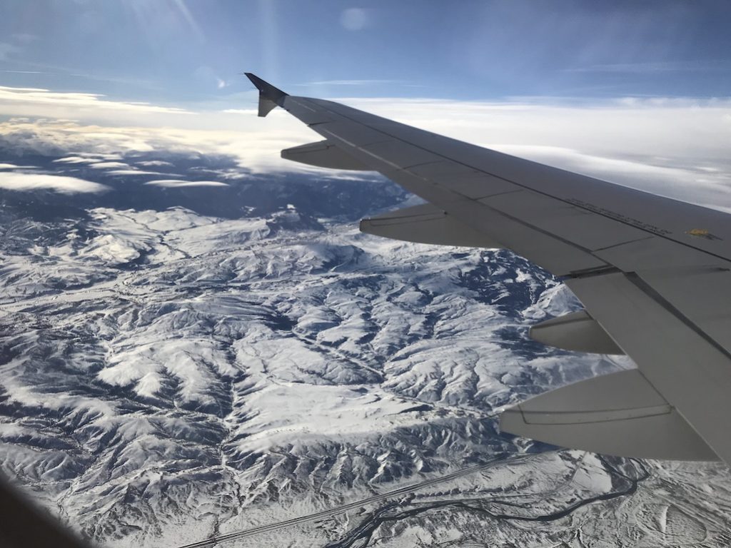 How To Be Financially Prepared To Take The Trip Of A Lifetime Travel Planning Plane ride window view flying