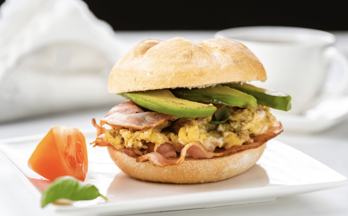 Egg Sandwich On Kaiser Roll With Avocado And Scrambled Egg