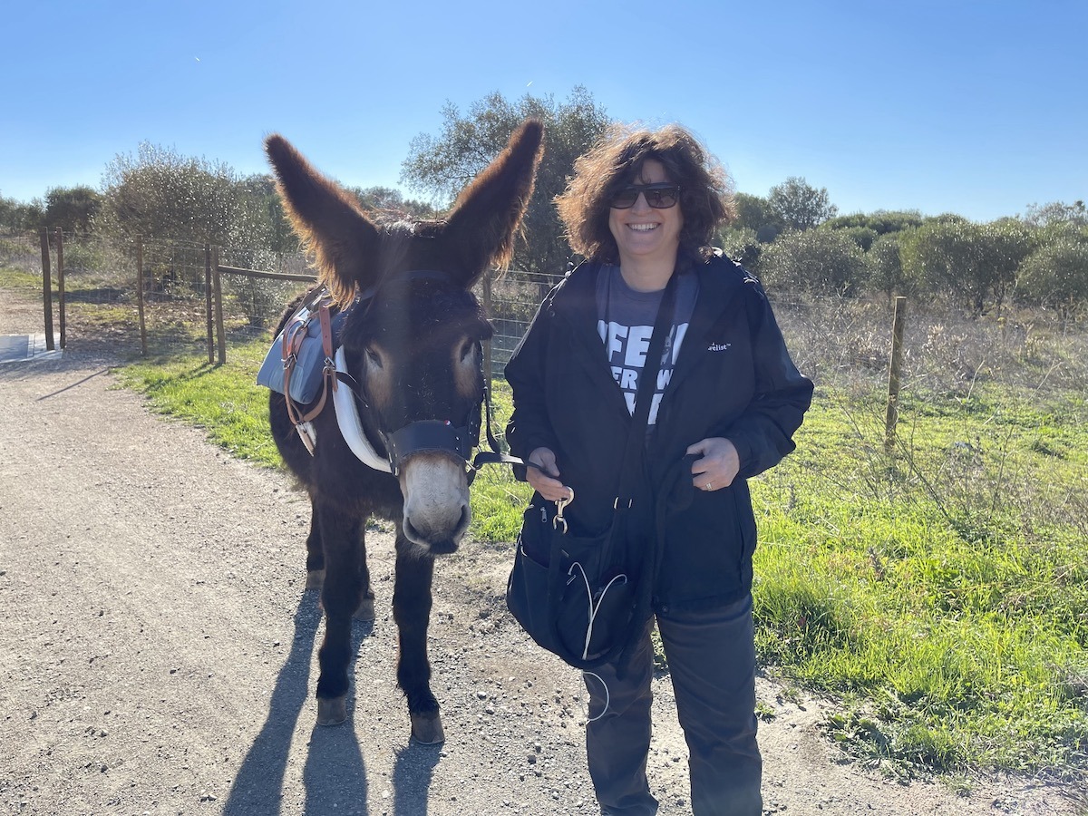 Diana with donkey friend at Quinta do Pisao Live in Portugal