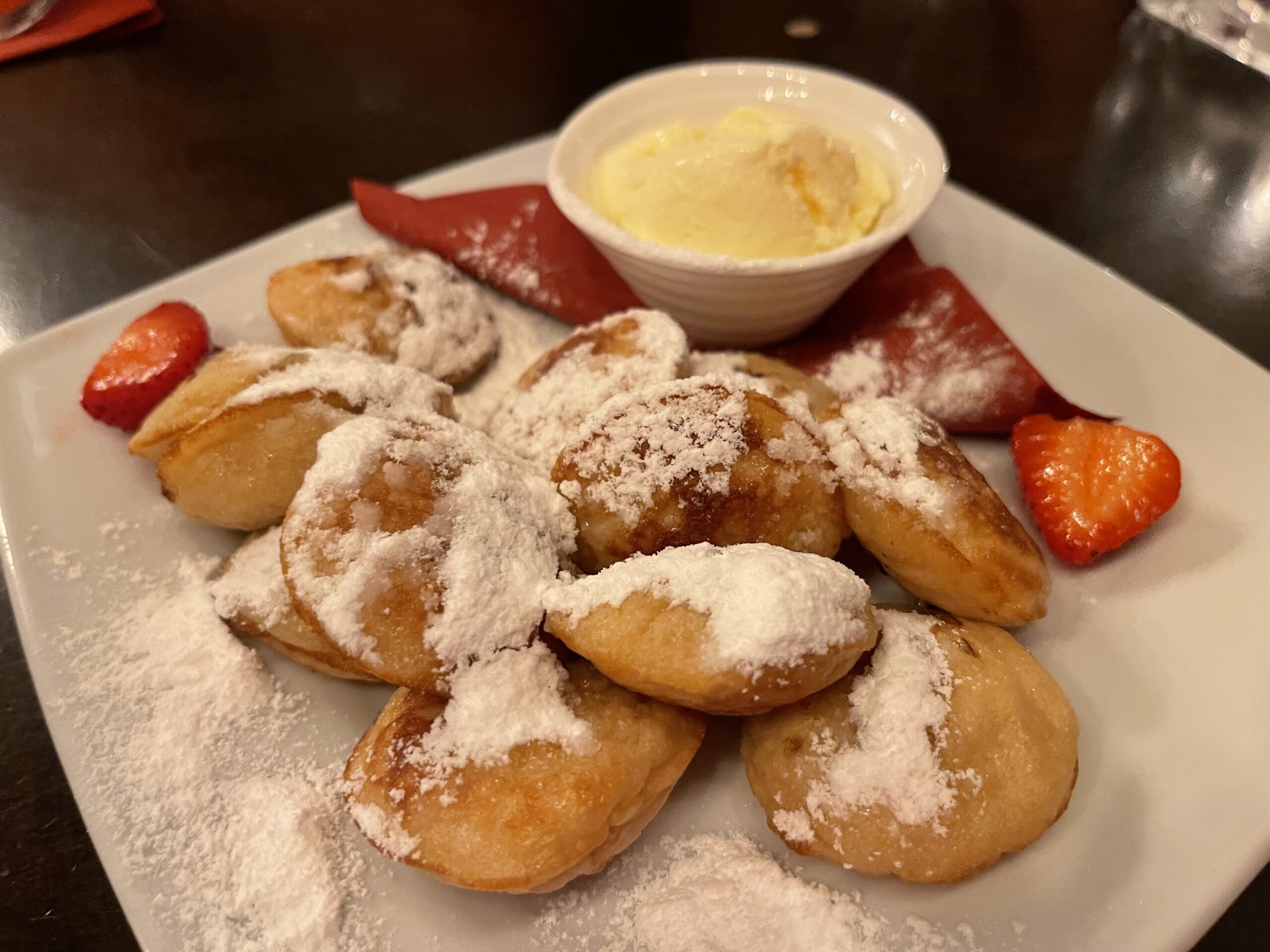 https://foodtravelist.com/wp-content/uploads/2023/07/Poffertjes-Mini-Pancakes-Dutch-scaled.jpeg